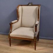 Wingback armchair in walnut, Louis XVI style – late 19th century