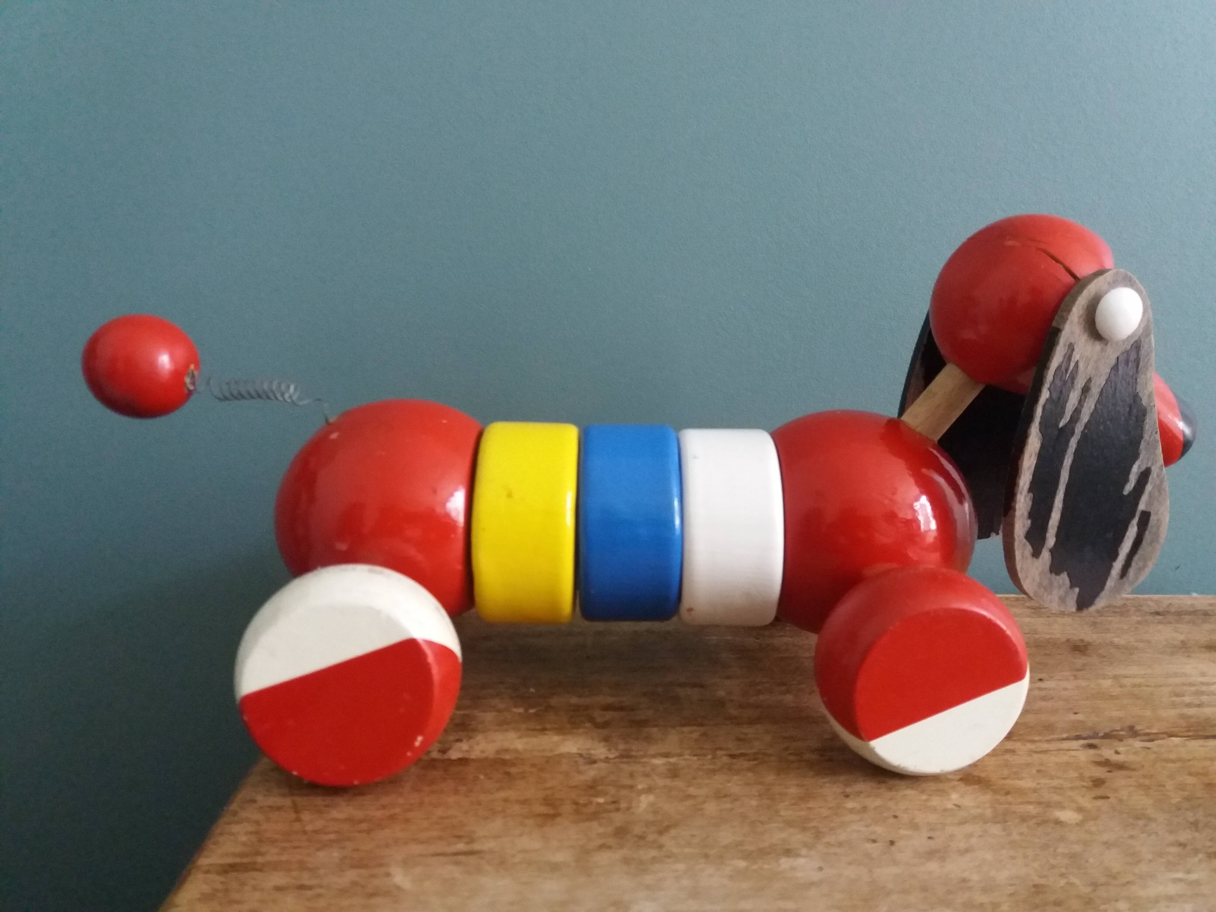 Lacquered wooden pull-along dog toy