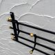Iron and brass coat rack
