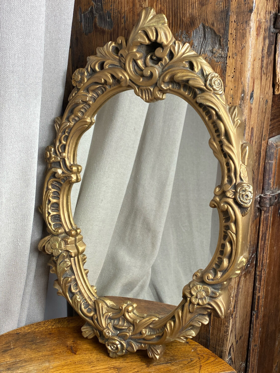 Rococo style mirror in wood and gilded stucco