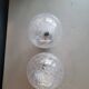 Pair of vintage wall lights in chrome metal with bubbled glass globes.