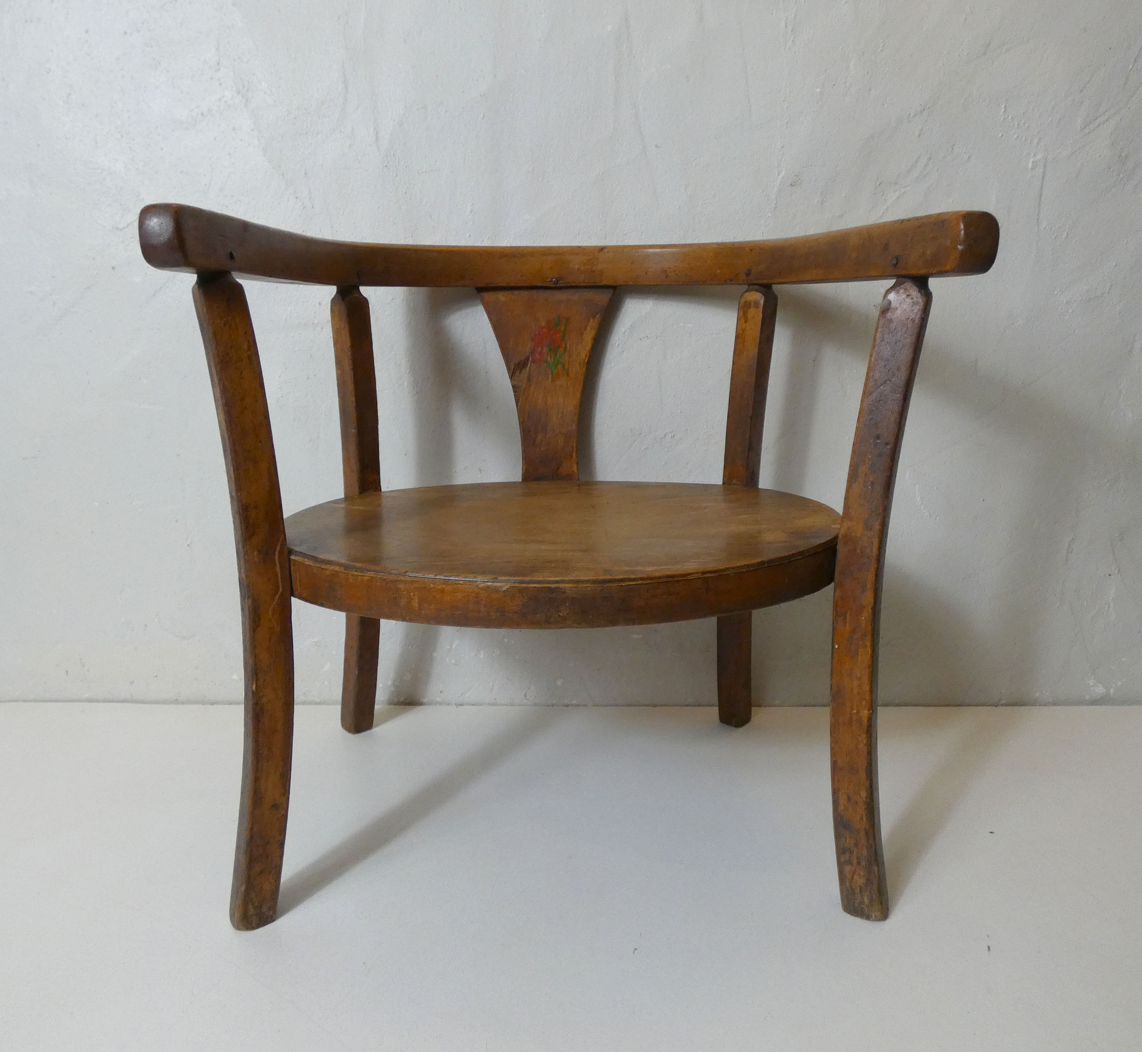 Old wooden armchair for children