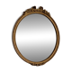 Antique oval mirror in Louis XVI style, gilded, with a bow pediment, 55cm.