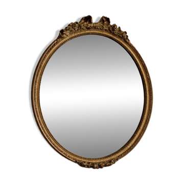Miroir ancien ovale de style Louis XVI doré, fronton noeud 55cm