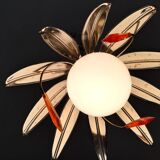 Chandelier with metal leaves and tassels