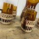 Carafe and glasses in amber glass and rattan