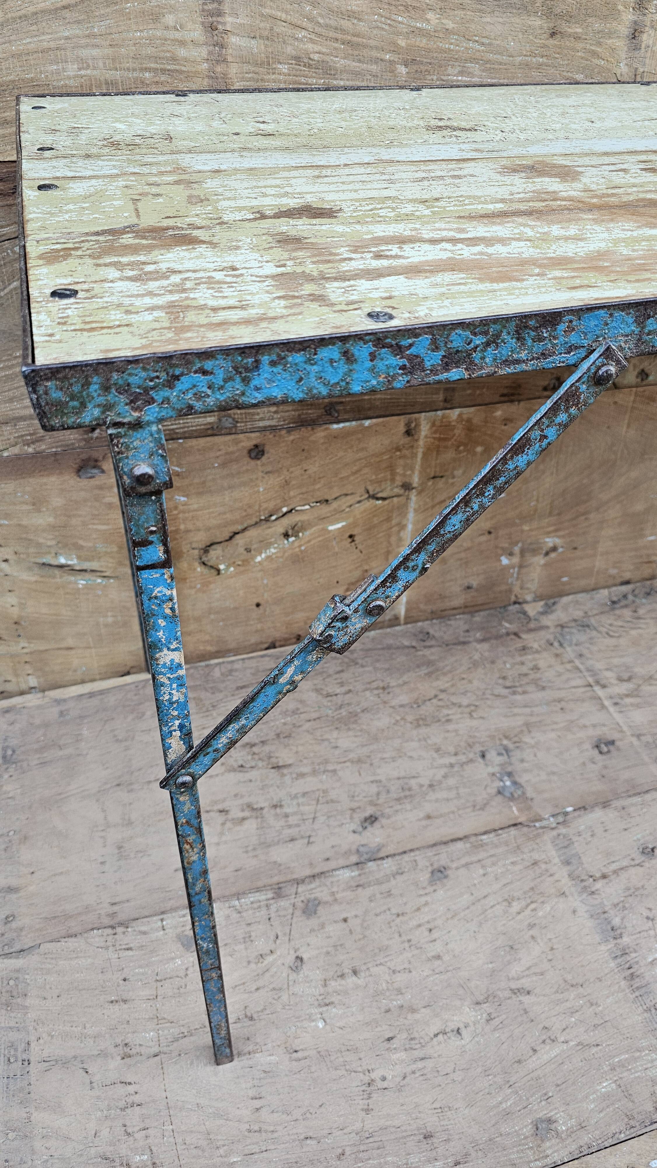 Old folding table in Burmese teak and steel