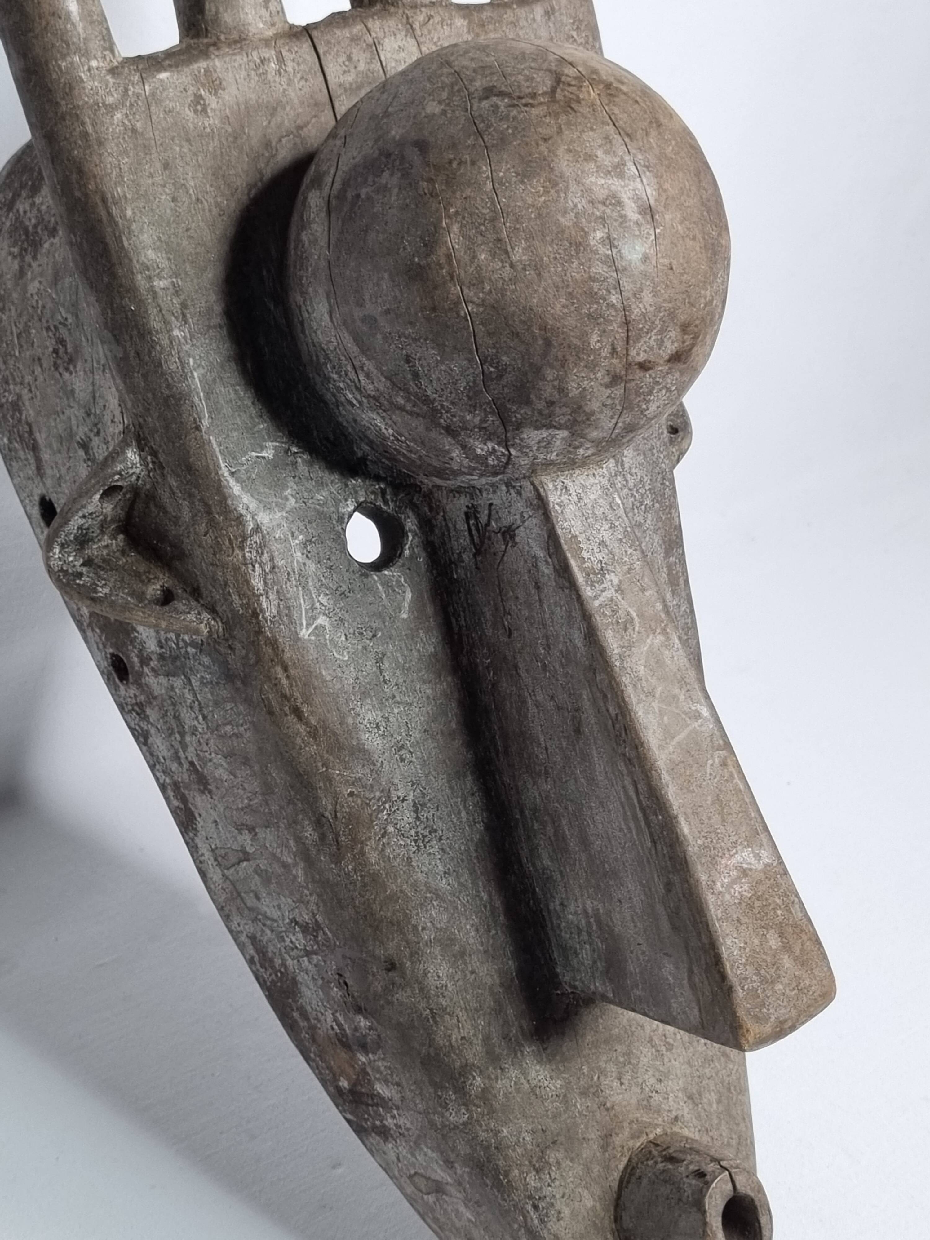 N'Tomo Bambara Mask, Mali, Carved Wood, Antique Patina, 20th Century, 64 cm