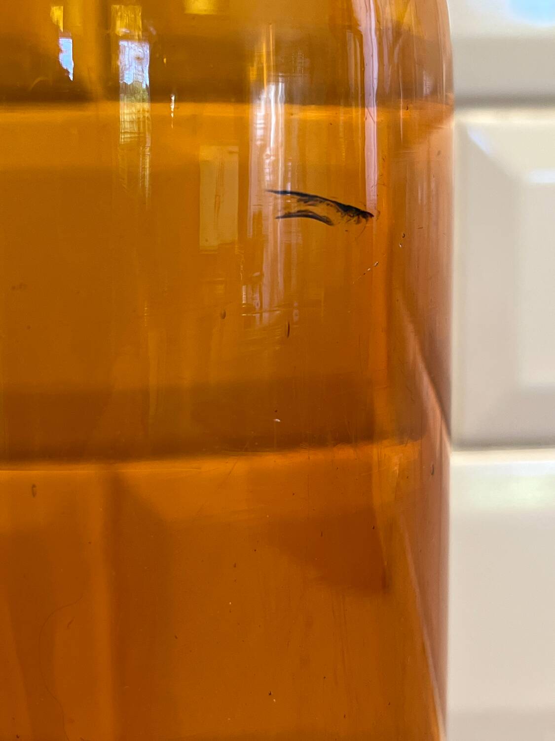 Amber glass bottle vase