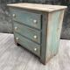Commode en bois patinée