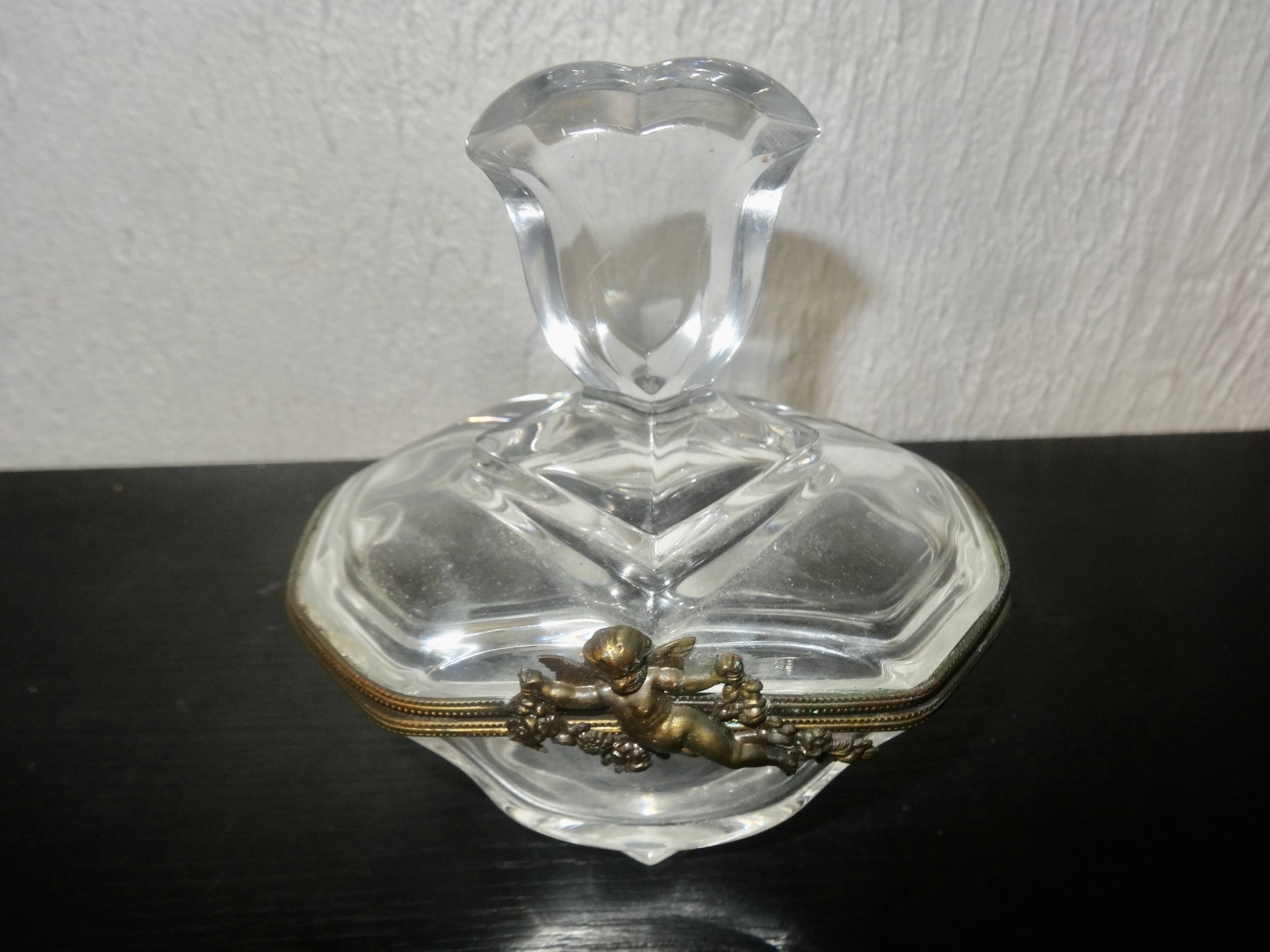 glass jewelry box with brass cherub decoration