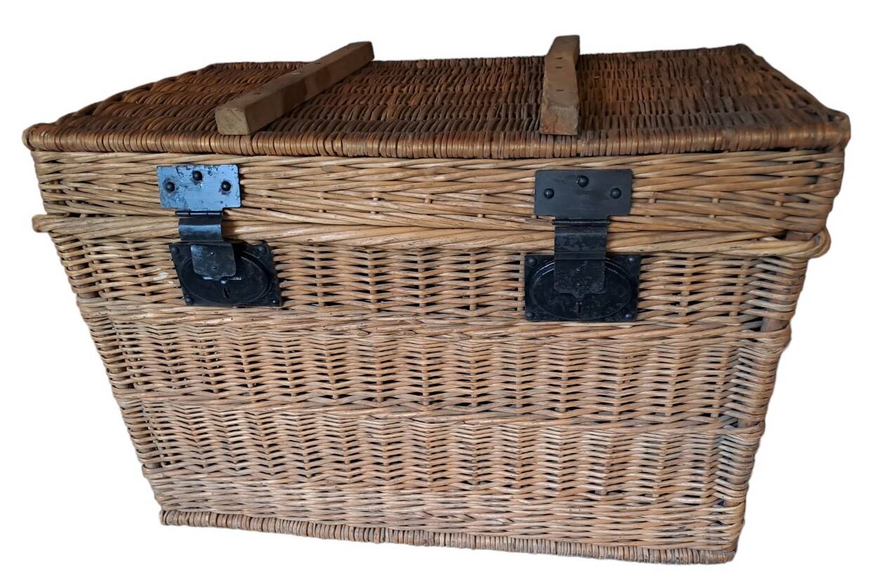 Wicker travel trunk XIX with metal clasps and handles.