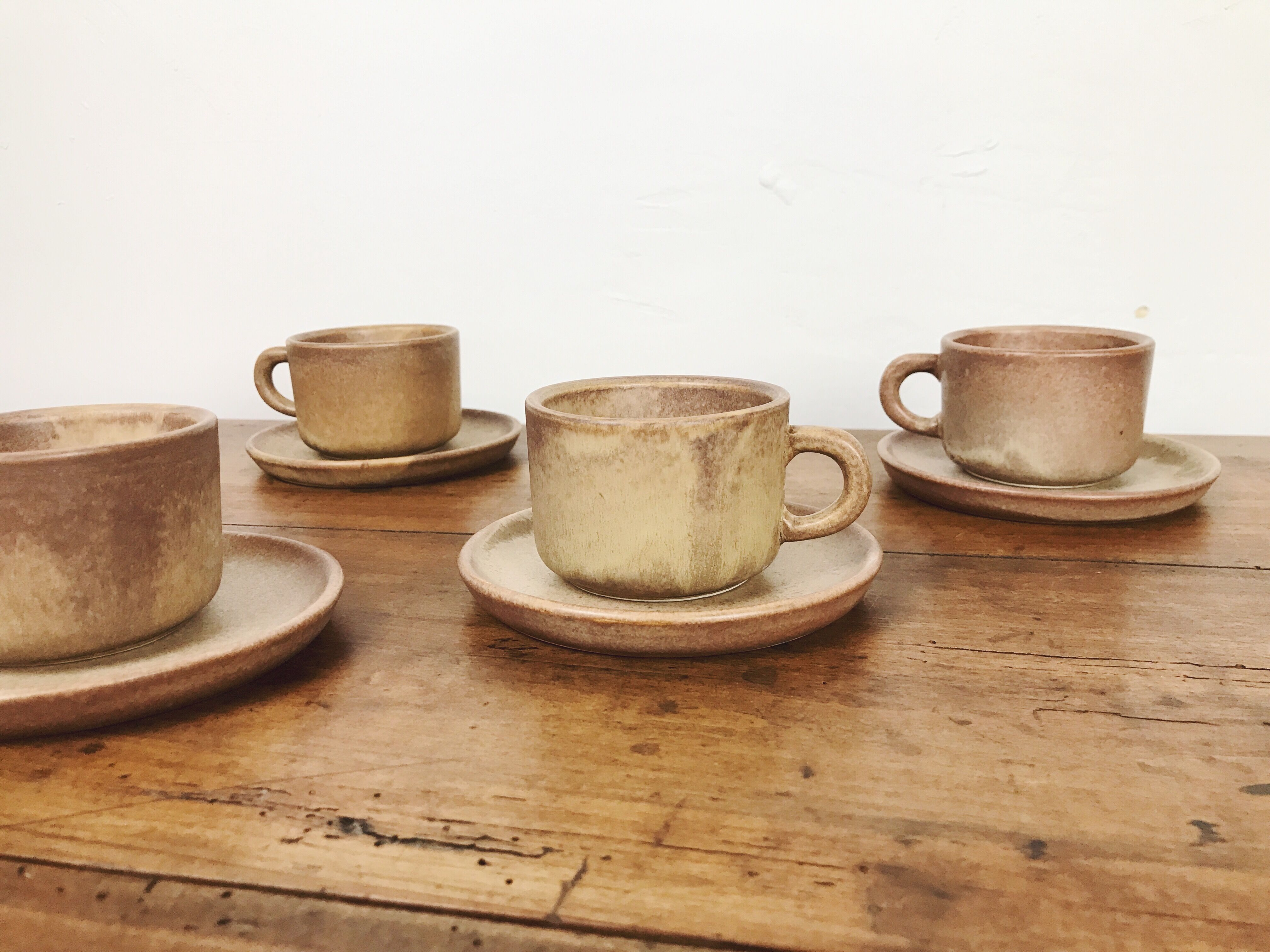 4 sandstone cups with under cups