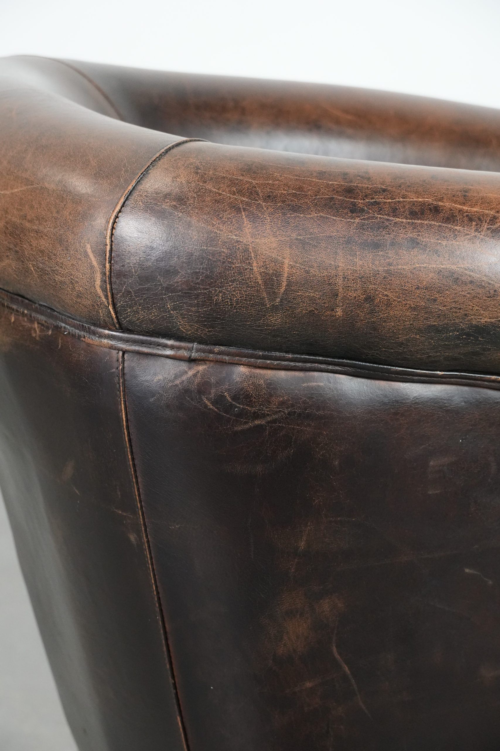 Characterful club armchair made of sheepskin with a beautiful patina