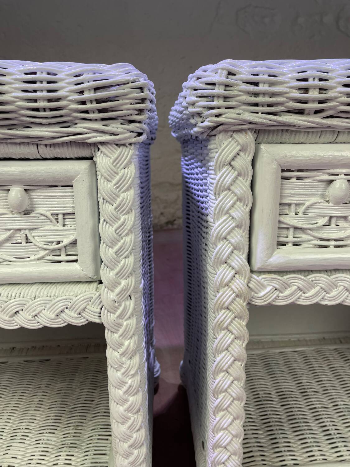 Pair of white lacquered rattan bedside tables