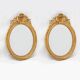 Pair of 19th century French oval gold leaf mirrors