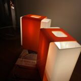 Pair of orange plexiglass wall sconces from the seventies.