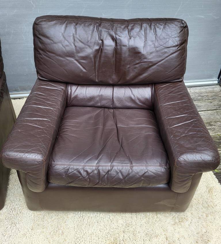 Pair of chocolate leather lounge chairs