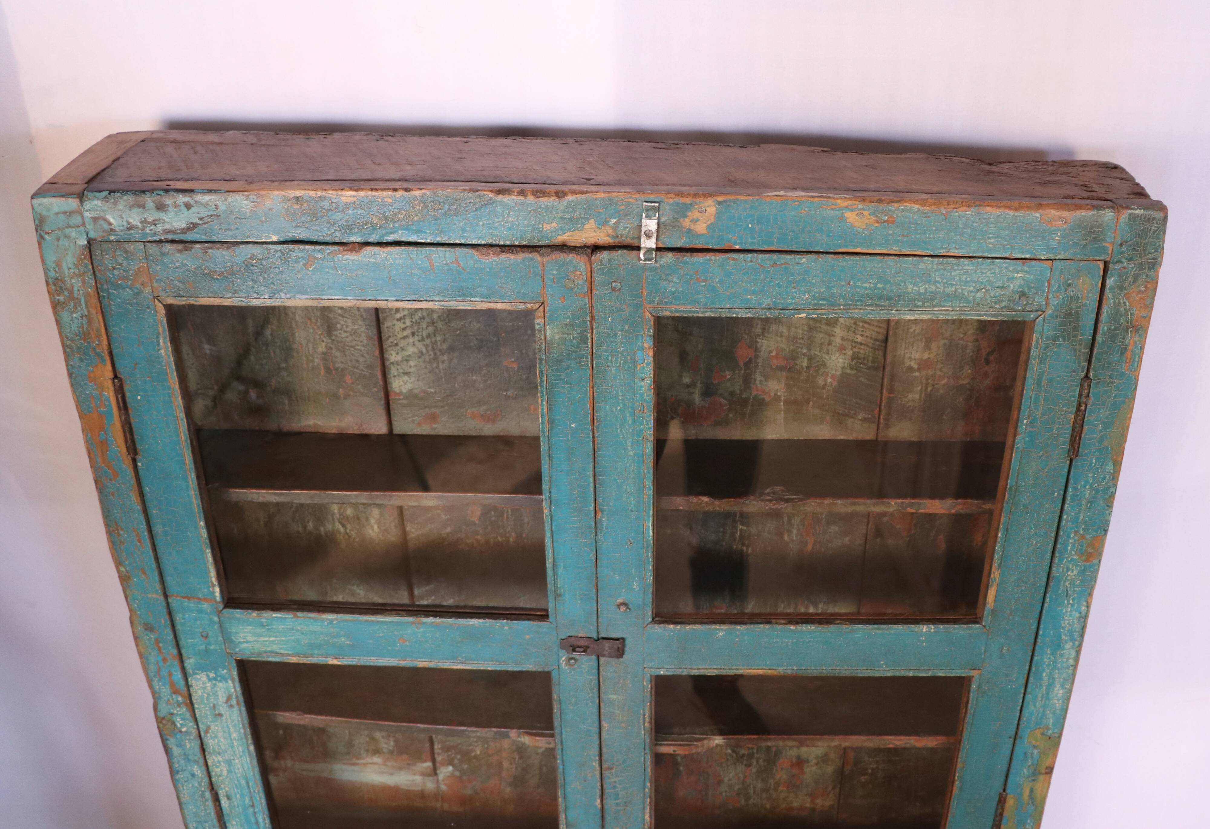 Old showcase in original blue patina Burmese teak