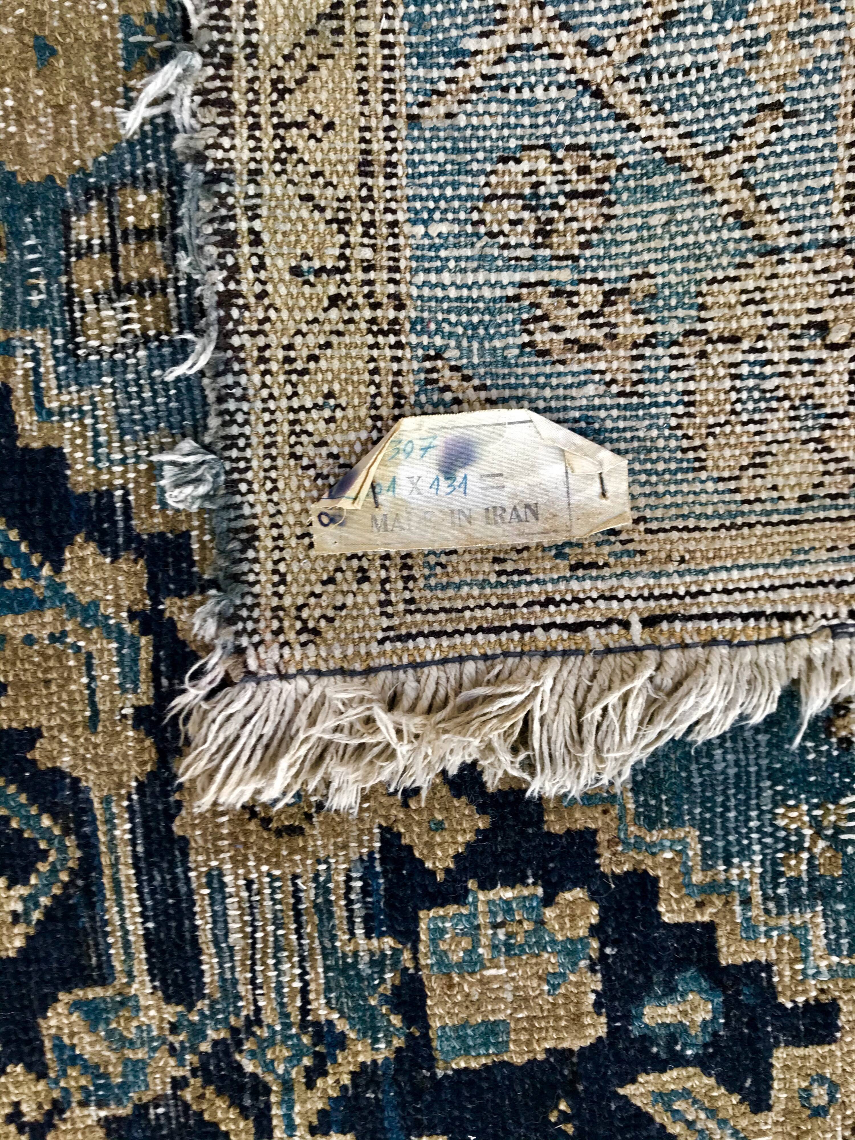 Persian carpet old green background, hand knotted, certified