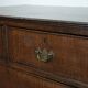 Antique English oak commode dating from the late 18th century.