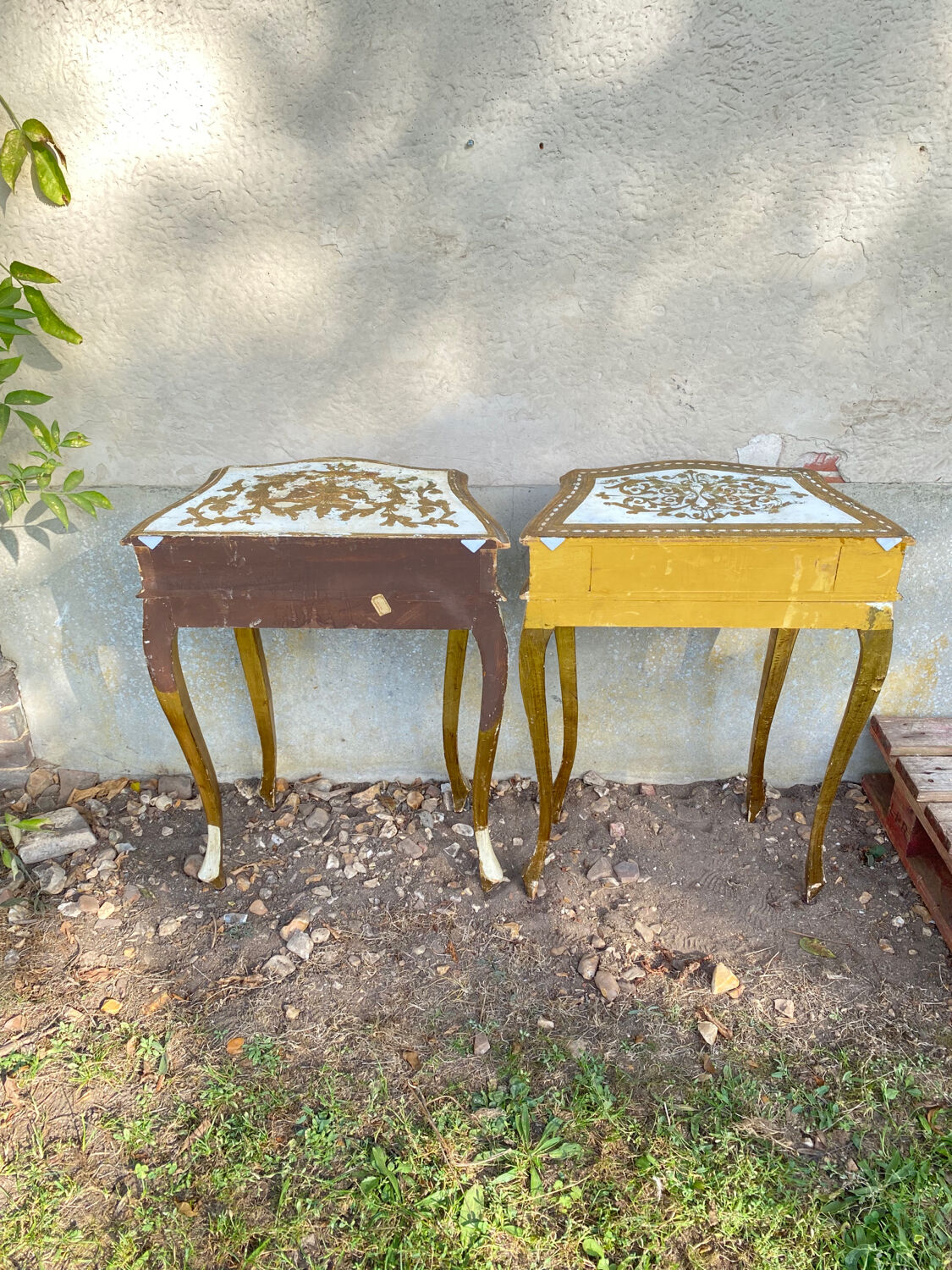 Pairs of Florentine bedside tables in gilded wood.