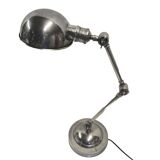 articulated desk lamp in chrome-plated brass