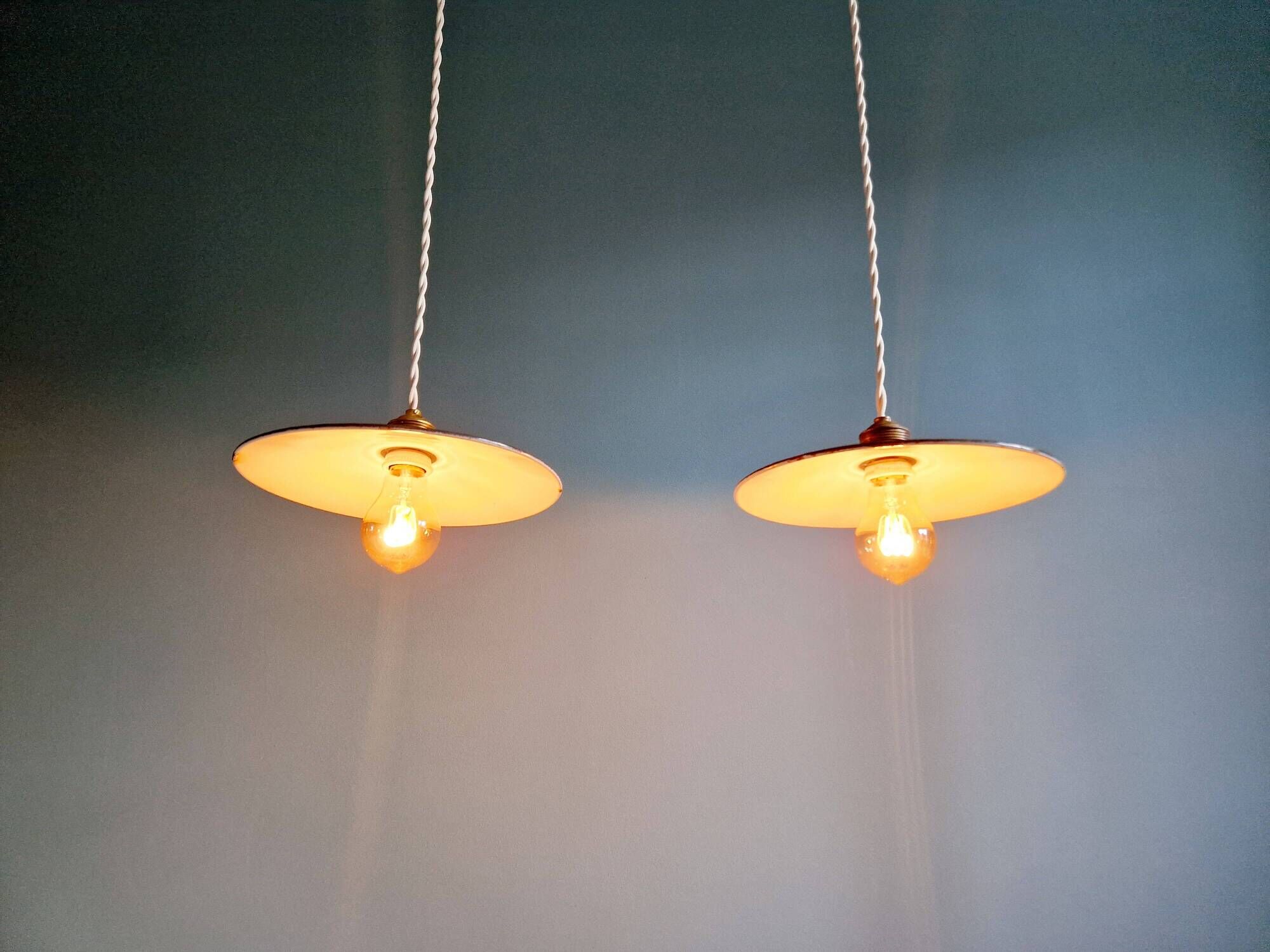Pair of industrial pendant lights in green enamelled sheet metal