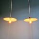 Pair of industrial pendant lights in green enamelled sheet metal