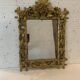 Louis XVI style mirror in carved wood and gilded with gold leaf, 19th century