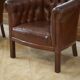 Paire de fauteuils Club capitonnés en cuir