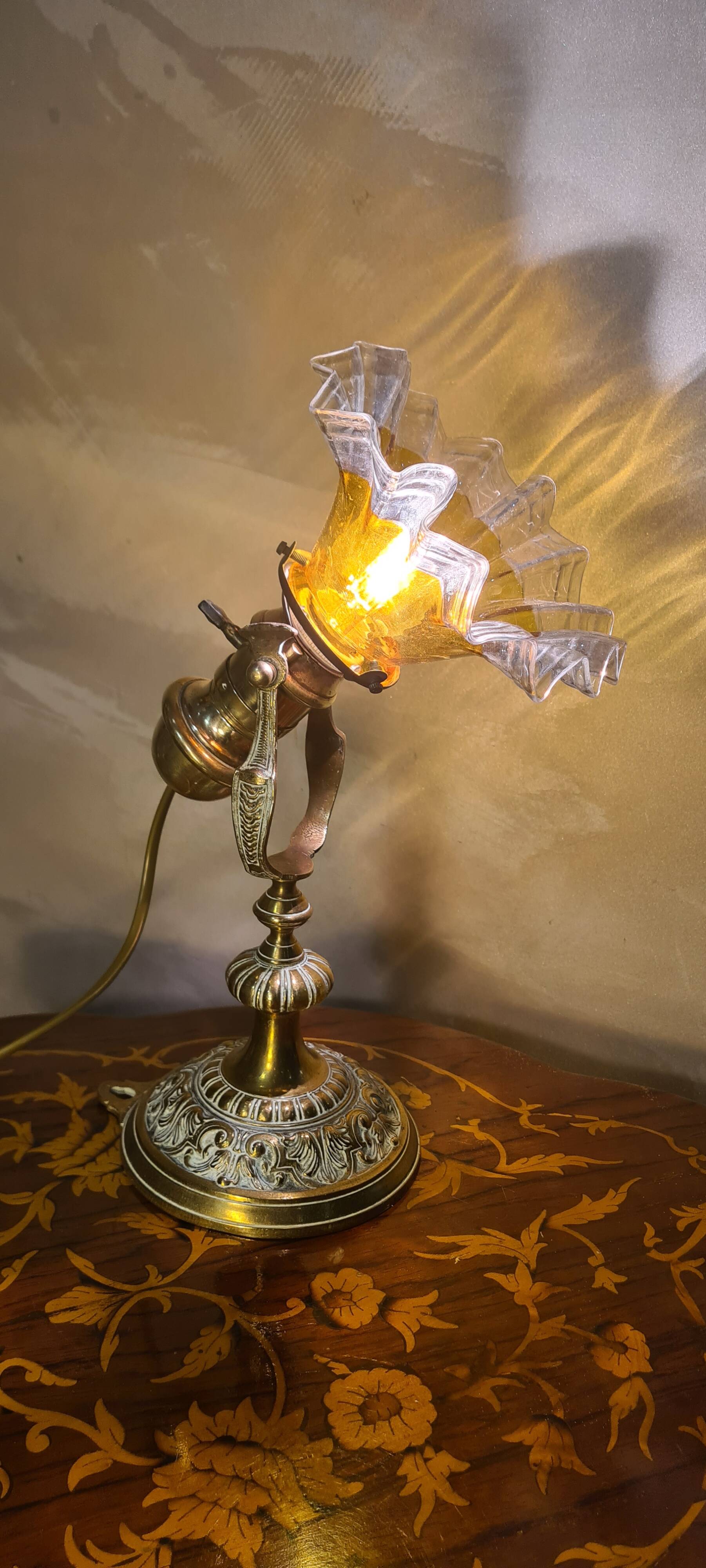 1920 bronze and brass rocking lamp with translucent amber-colored shade