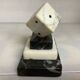 A marble dice bookend