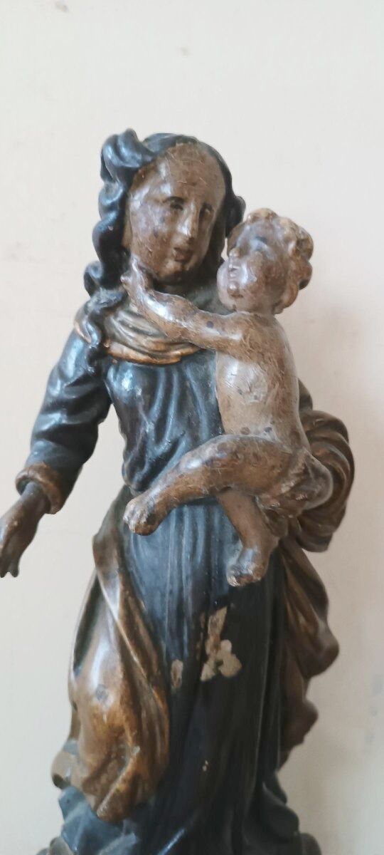 Ancient polychrome wooden sculpture representing the Virgin and Child, from