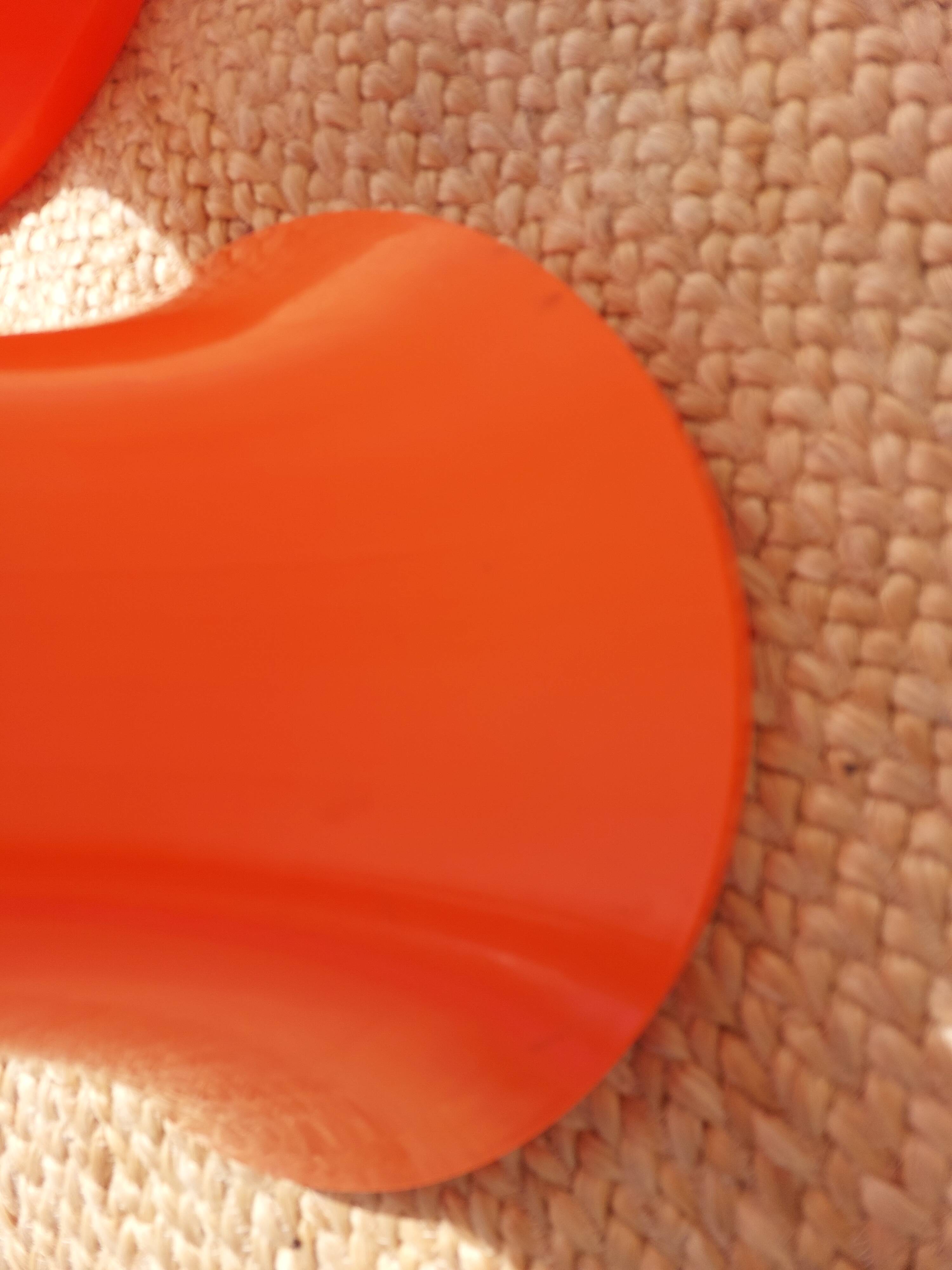 pair of orange tam-tam stools