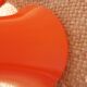 pair of orange tam-tam stools