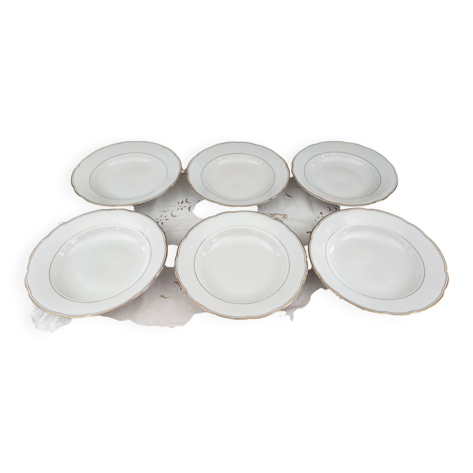 Set of 6 deep plates in fine porcelain from Bohemia with a gold rim.