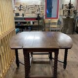 Wooden table with gateleg flaps