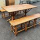 Vintage 1950s set: large table with tripod base and benches in woven chestnut