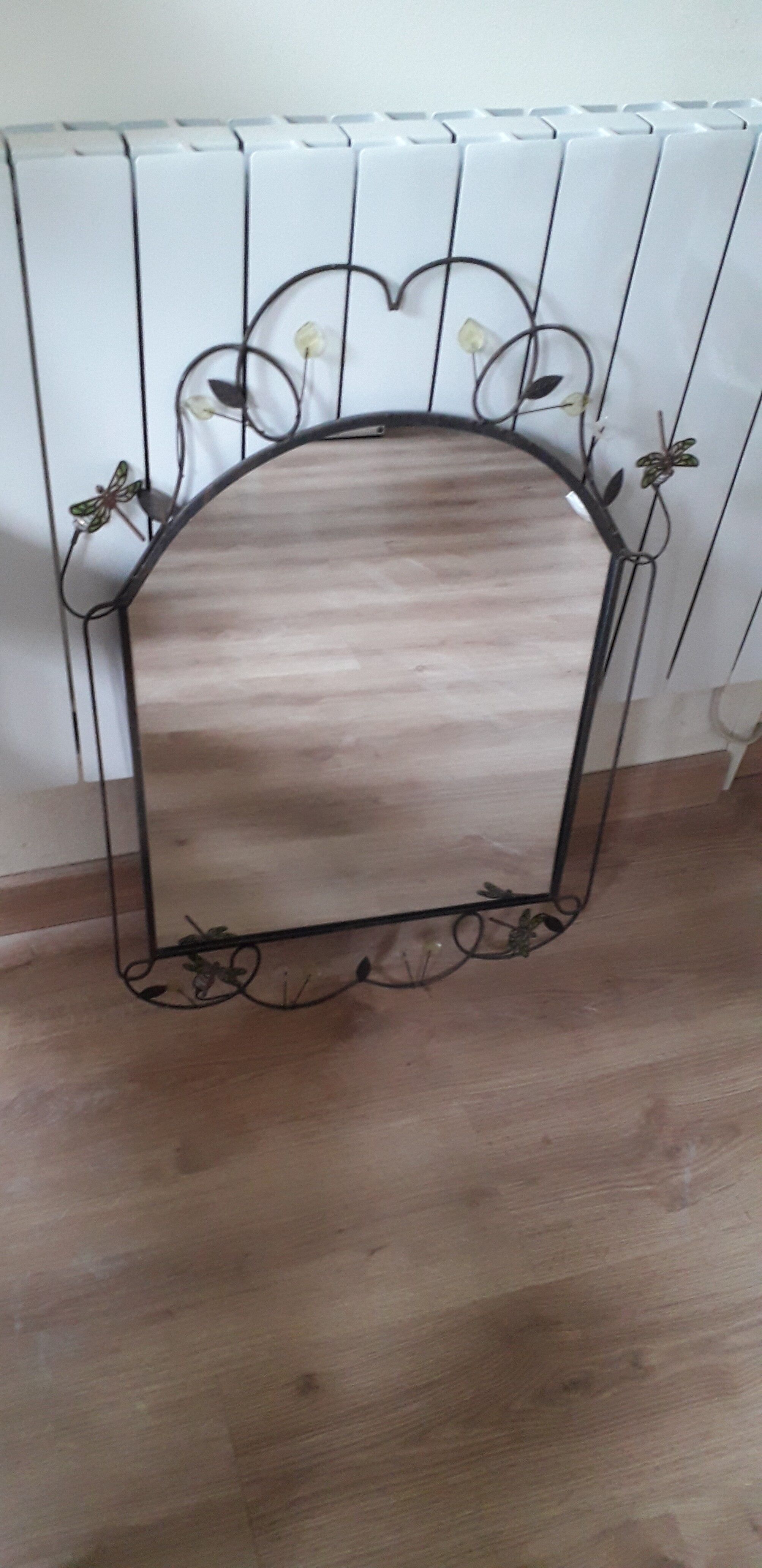 Mirror of shape with flower and dragonfly patterns