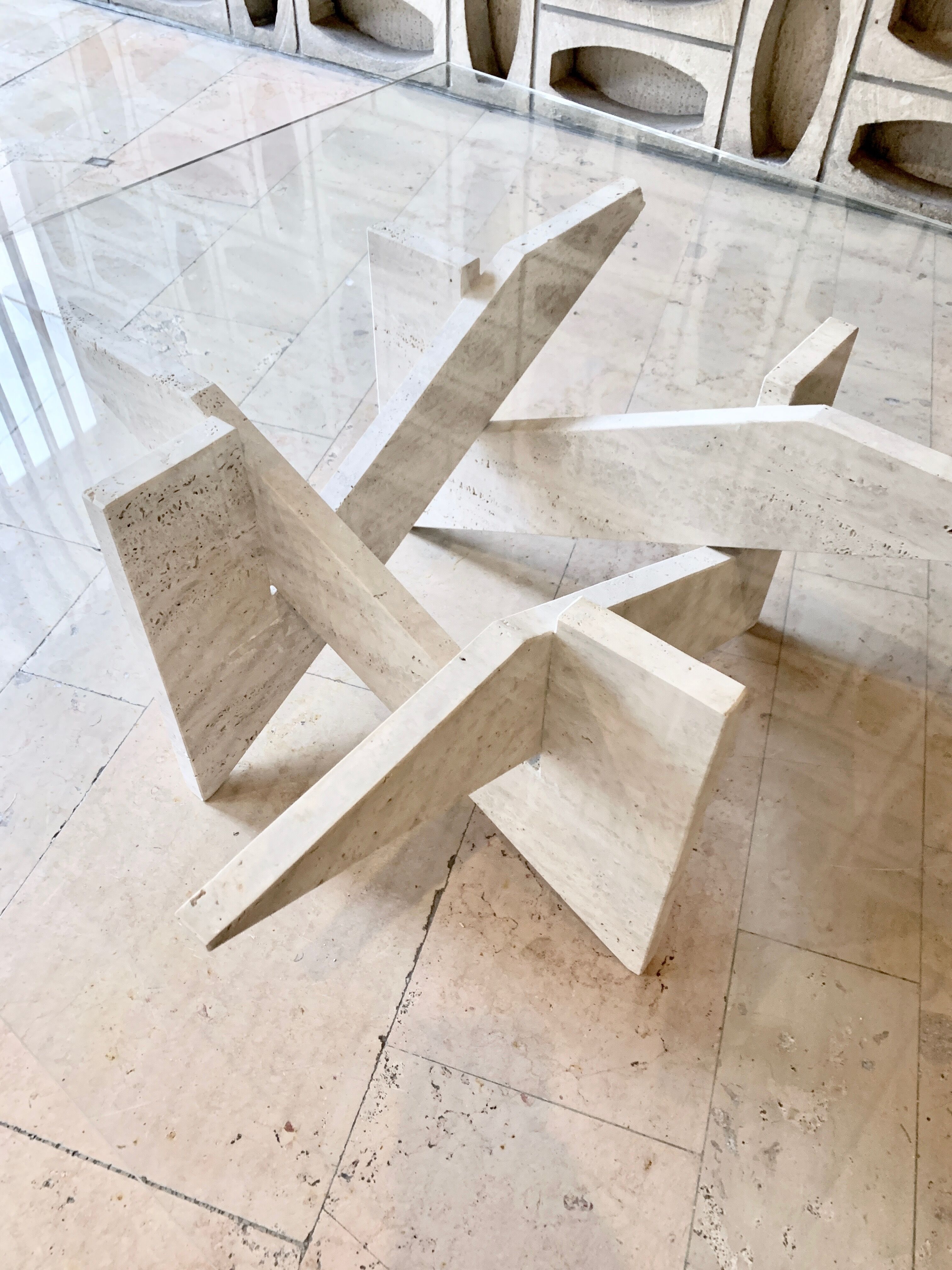 Travertine sculptural coffee table with square top