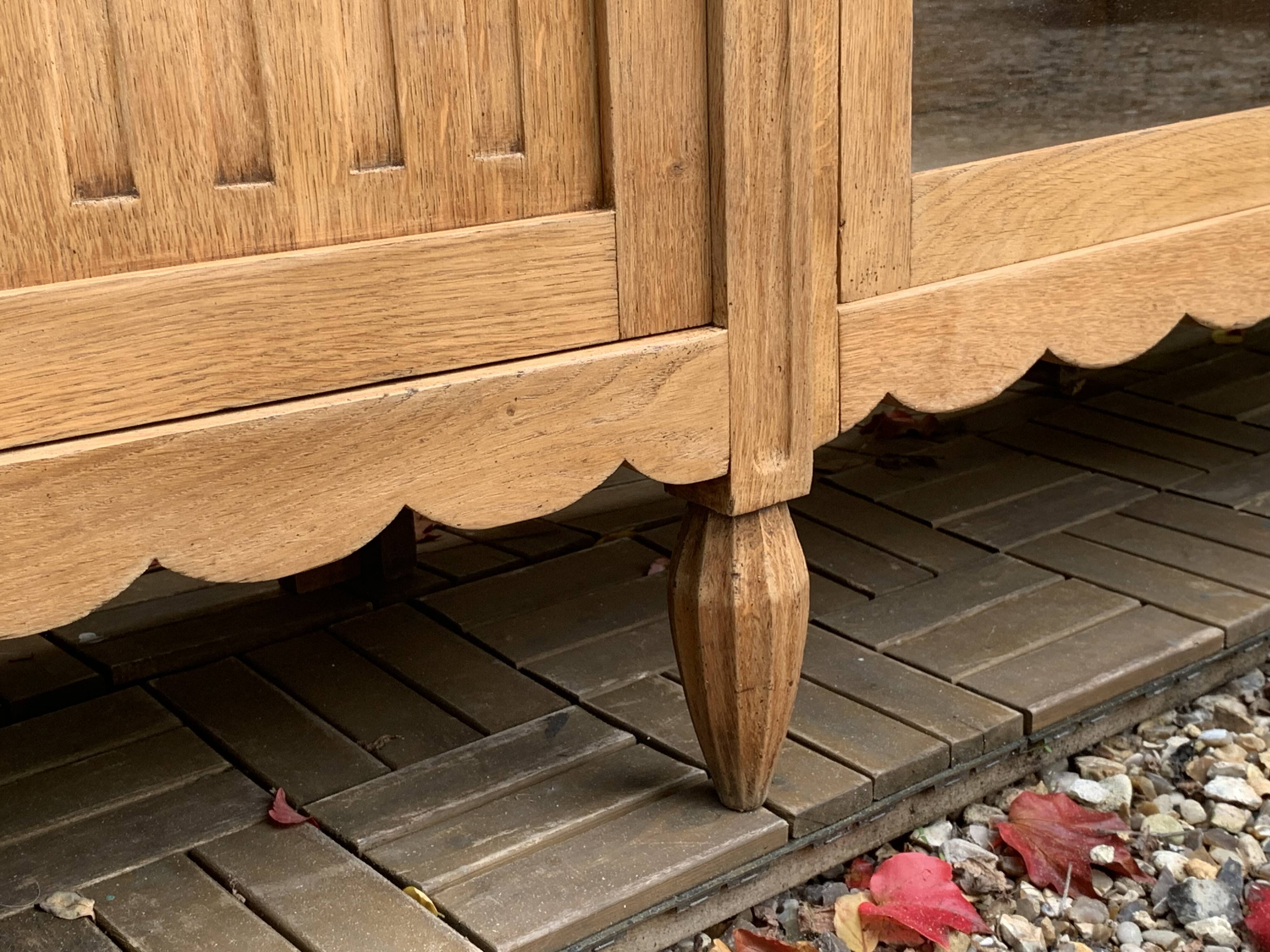 Parisian Art Deco asymmetrical glass cabinet in raw oak, 1930