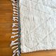 Berber carpet blessed white ouarain patterns with reliefs and black finishes