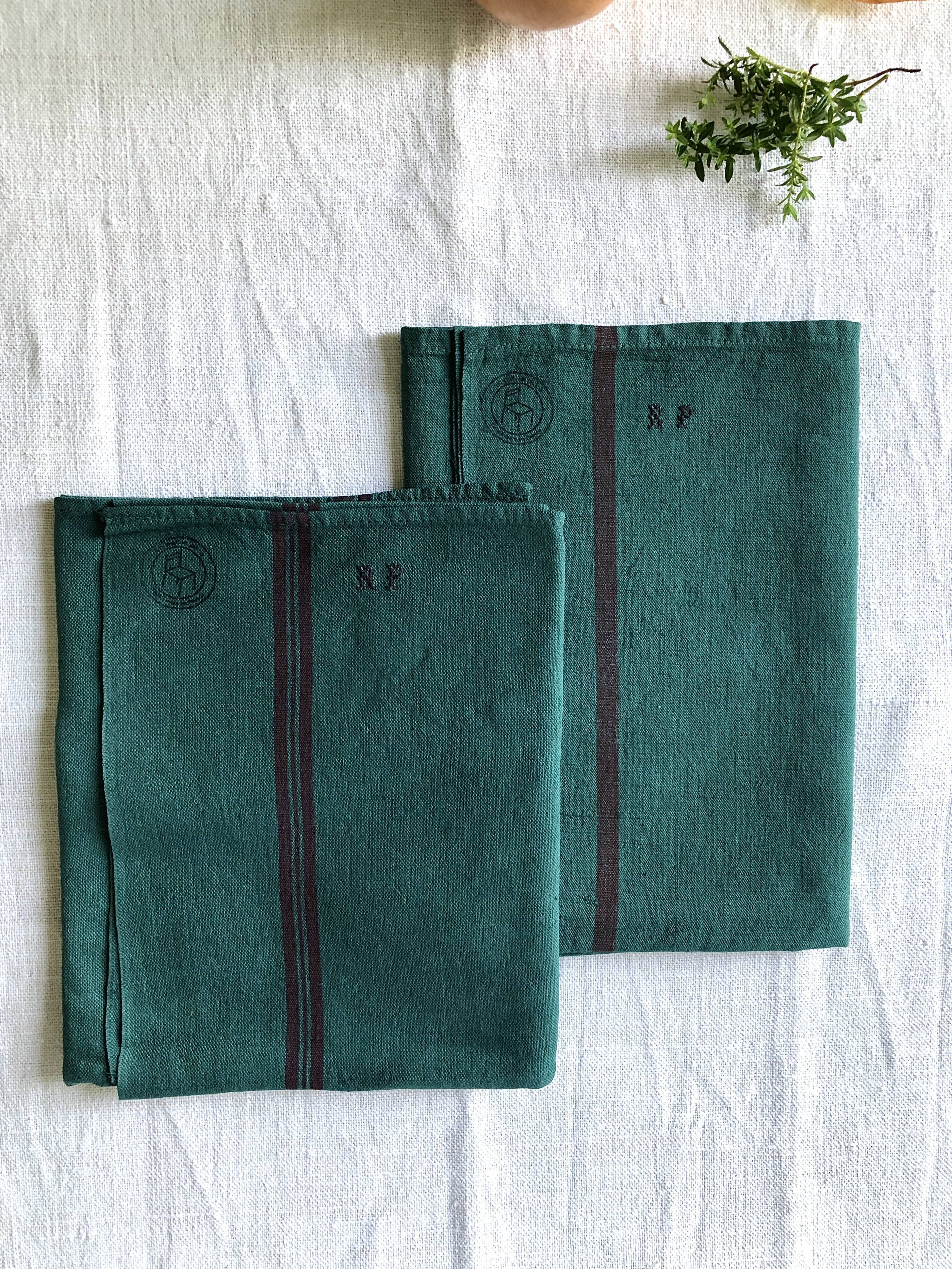 Old linen and cotton tea towel tinted in fir green
