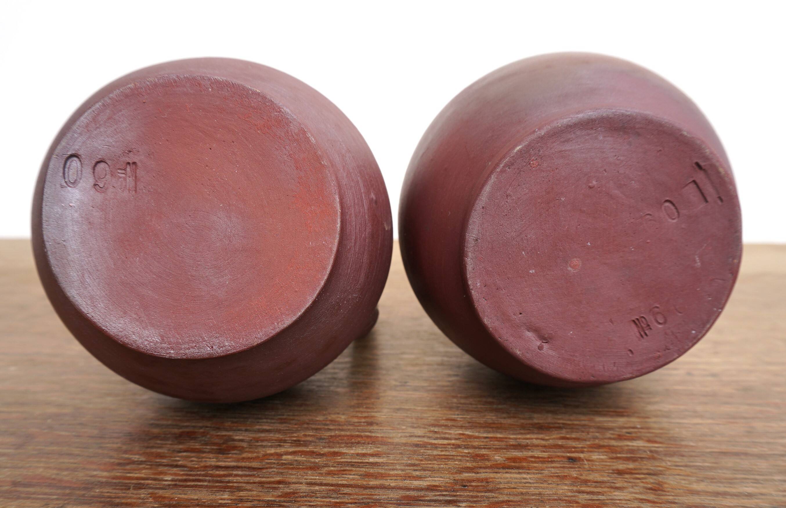 pair of terracotta bottles or carafes