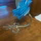 Art Deco style wall light in frosted blue glass with silver metal support.