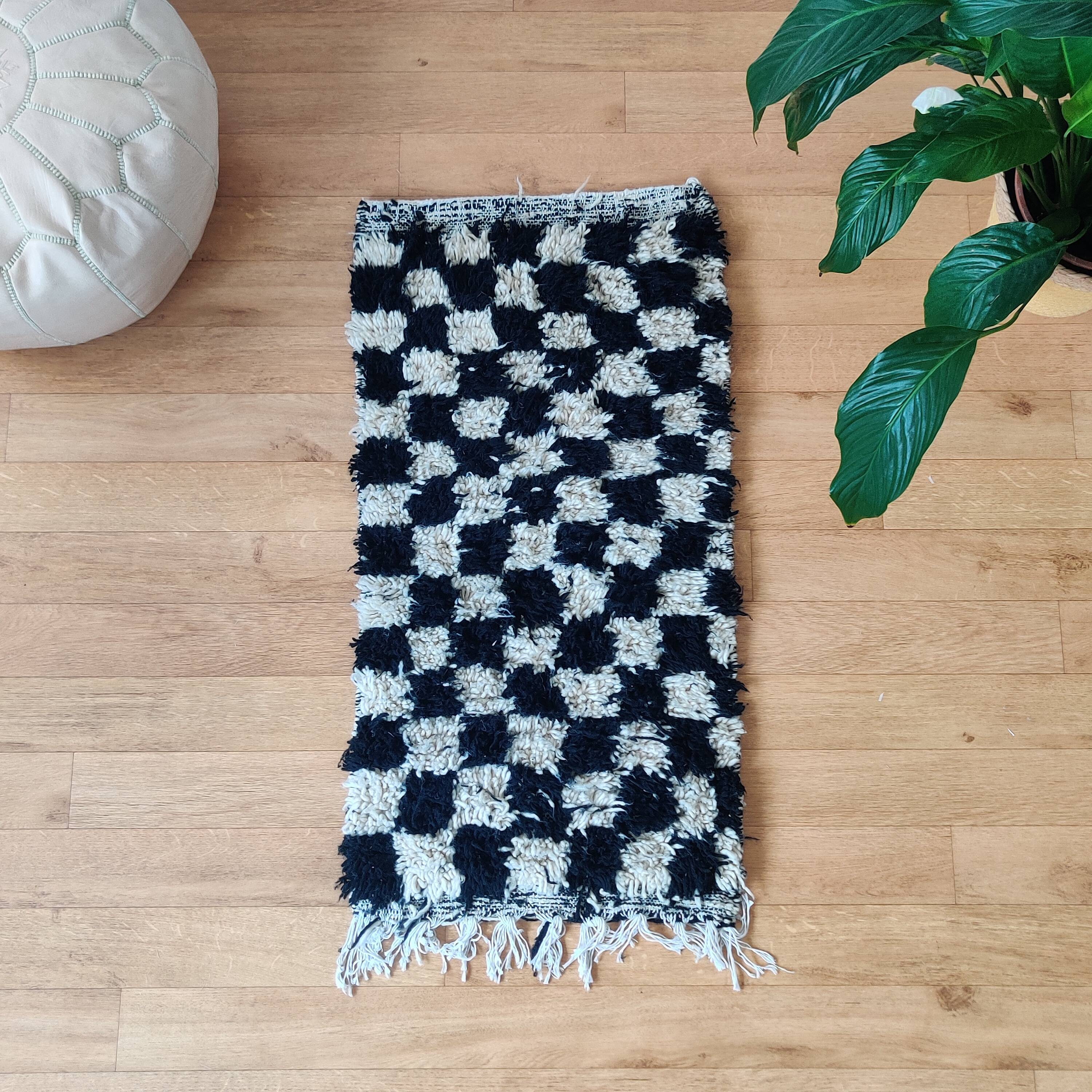 Small black tile Berber rug