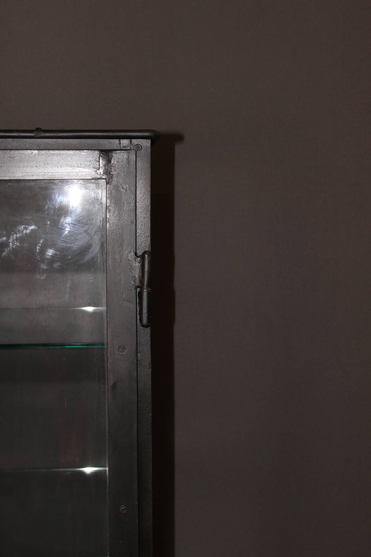 Iron display cabinet with black patina from around 1920