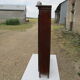 Small solid wooden cabinet with a gendarme hat