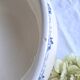 Antique mismatched earthenware soup plates with a tureen